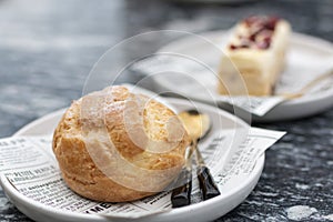 Cream puff, or chou ÃÂ  la crÃÂ¨me is a filled French choux pastry ball with a typically sweet and moist filling of whipped cream, photo